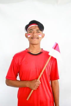 Confident young Indonesian man in red t-shirt.Indonesia Independence Day Concept Stock Photos