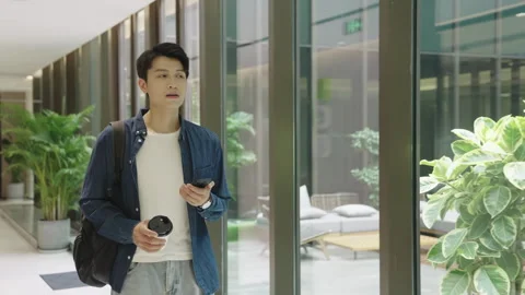 Confident young man going to interview locations or partner meeting in modern Stock Footage 333686034