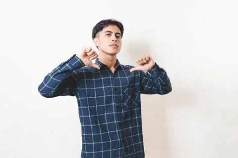 Confident young man pointing at himself with a proud, arrogant expression, .. Stock Photos