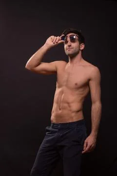 Confident young man posing abs Stock Photos