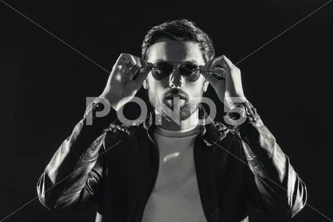 Confident young man with sunglasses Stock Photos