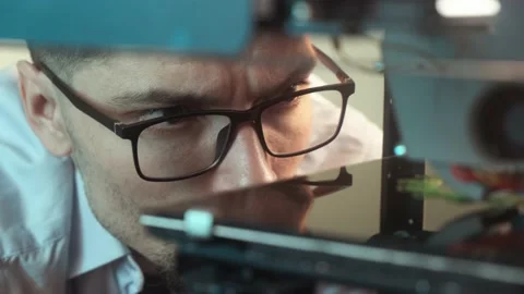 Confident young student using a 3D printer in college Stock Footage 236616094