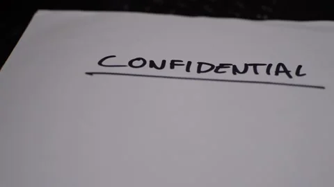 Confidential document folder on a black laptop. private confidential file. Vidéo 225849538