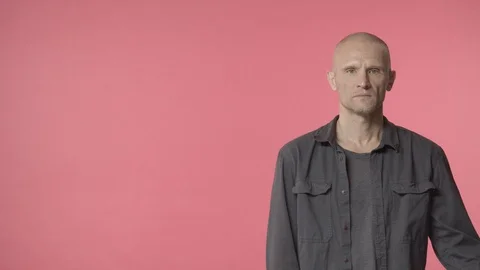 Confient, serious handsome middle-aged man, bald guy, veteran, look assertive Stock Footage 128650873