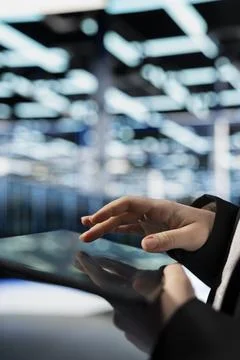 Configuring gear, typing on tablet and computer scientist in data center Foto stock
