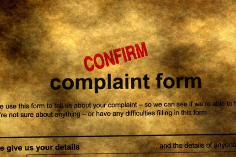 Confirmed Complaint Form with Red Stamp on Vintage Paper Background 写真素材