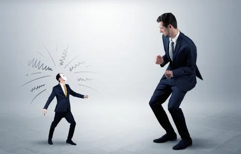 Conflict between small and big businessman Stock Photos
