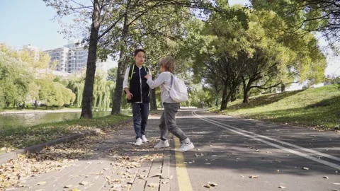 Conflict between two schoolboys. Boys start fighting in school yard. Stock Footage 140083018