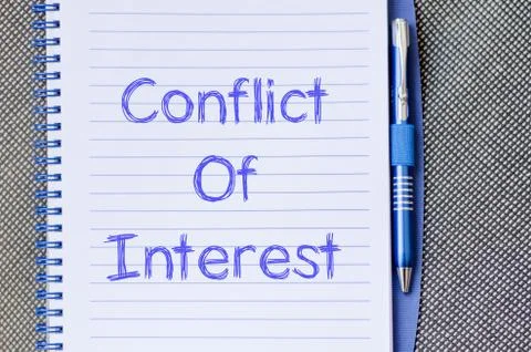 Conflict of interest write on notebook Stock Photos
