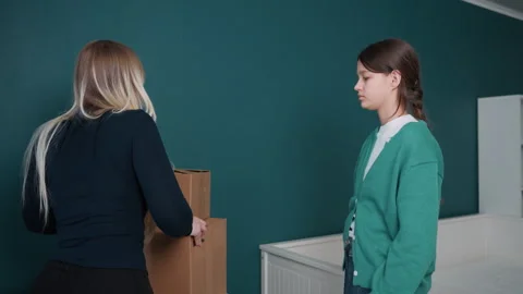 Conflict over boxes in apartment. Young roommates argue amidst cluttered Stock Footage 337228905
