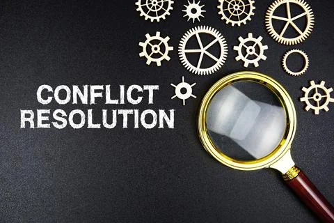 Conflict Resolution text message with magnifying glass on black background Foto stock