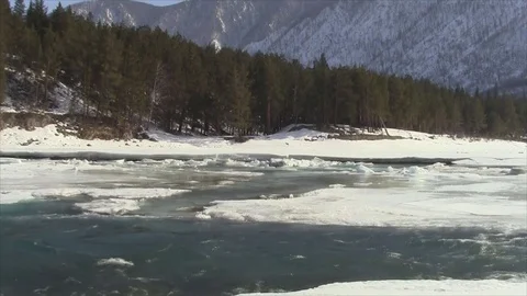 Confluence of melting rivers in the early spring, Altai, Russia Stock Footage 79252158