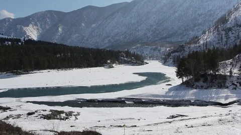 Confluence of melting rivers in the early spring,  Altai, Russia Stock Footage 79252368