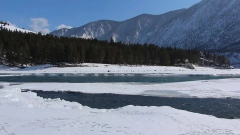 Confluence of melting rivers in the early spring,  Altai, Russia Stock Footage 79252482
