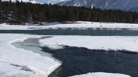 Confluence of melting rivers in the early spring,  Altai, Russia Stock Footage 79252551