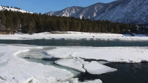 Confluence of melting rivers in the early spring,  Altai, Russia Stock Footage 79252765