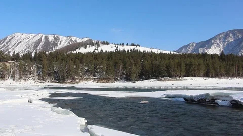 Confluence of melting rivers in the early spring, Altai, Russia Stock Footage 79252826