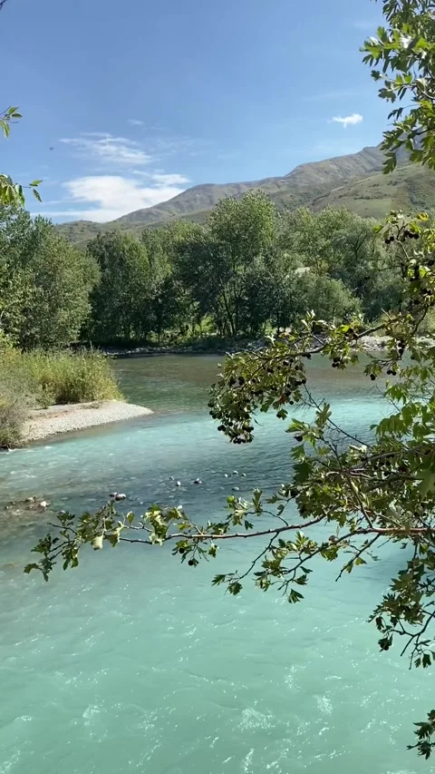Confluence of two mountain rivers: azure and emerald color Stock Footage 251660918