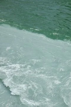Confluence of two rivers of different colors Stock Photos