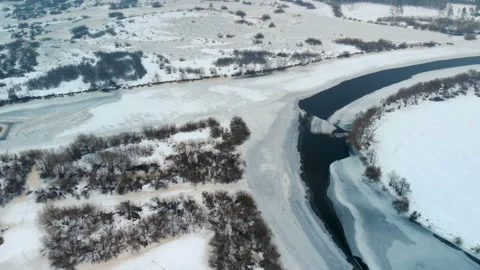 Confluence of two rivers in winter Видео 105795873