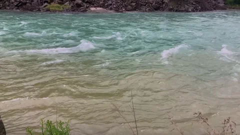 Confluence of water in a mountain river. Video stock 157732913