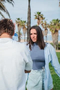 Confrontation between two individuals with intense emotions in a dynamic outdoor Stock Photos