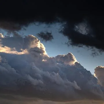 Confrontation of light and darkness. Clouds lighted with sun versus dark Stock Photos