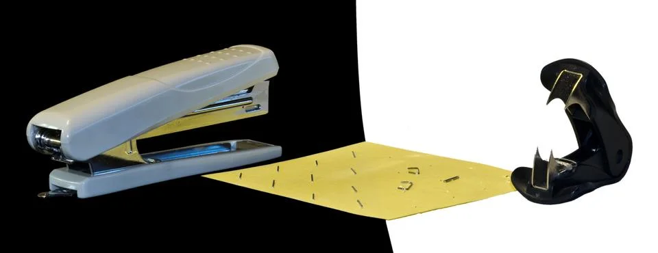 Confrontation stapler vs antistapler Stock Photos