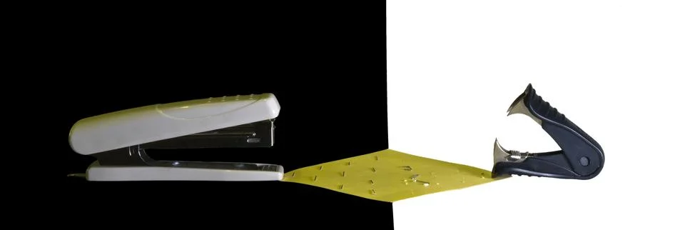 Confrontation stapler vs antistapler Stock Photos