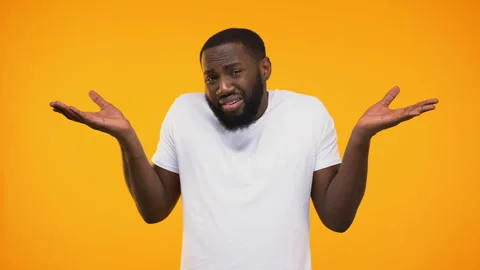 Confused african american person showing do not know gesture and shrugging Stock Footage