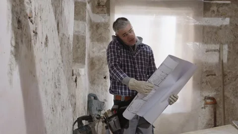 Confused and puzzled construction builder worker on a renovation building s.. Stock Footage 307841505