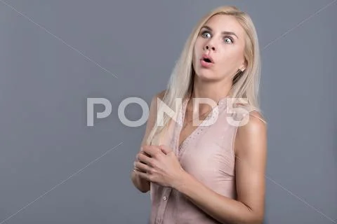Confused and surprised beautiful woman opening mouth Stock Photos
