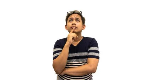 Confused and thinking expression of Asian Malay man looking on empty space. Stock Photos