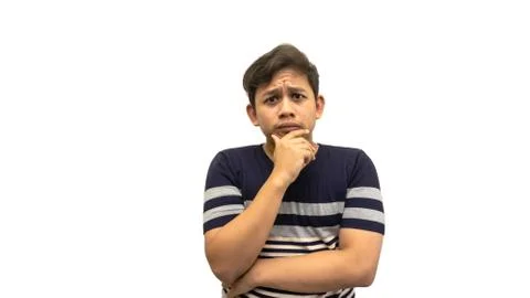 Confused and thinking face expression of Asian Malay man with hand on the chin Stock Photos