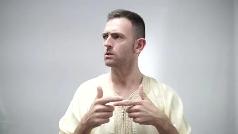 Confused Arabian man makes gesture to both sides. Undecided, dubious and unsure Stock Footage 218499668