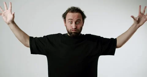 Confused Bearded Man Expressing Surprise and Frustration on White Background Stock Footage 344269545