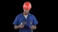 Confused blue collar worker tries to understand tools - humor HD Footage