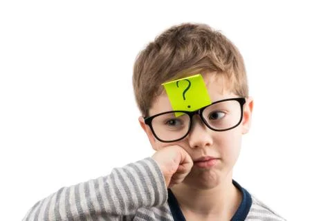 Confused boy thinking with question mark on sticky note on forehead Stock Photos