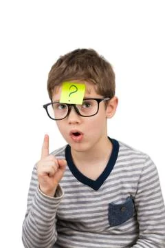 Confused boy thinking with question mark on sticky note on forehead Stock Photos
