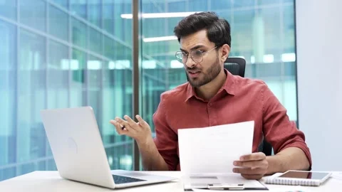 Confused businessman having difficulty with paper work checking documents  Stock Footage 288880617