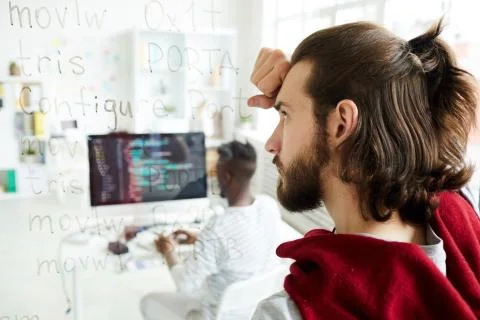 Confused coder looking at computer text Stock Photos