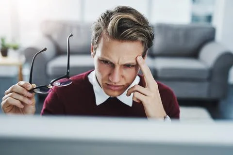 Confused, computer and man in home for remote work with glitch online for Stock Photos