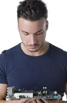  Confused Confused, puzzled computer technician, a handsome young man, loo... Stock Photos