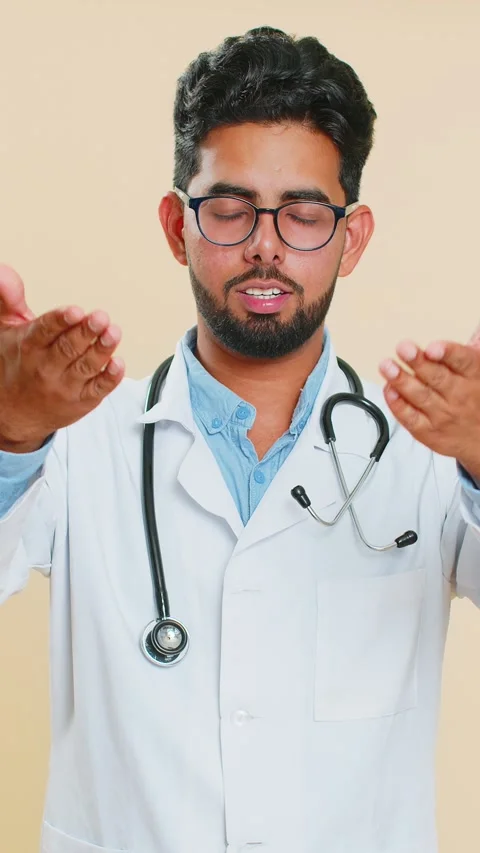 Confused doctor man pointing at camera showing stupid asking for insane crazy Stock Footage 347055576