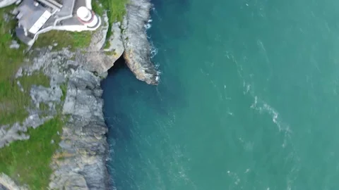 Confused Drone Pilot Looking For Angle. Aerial View of Cliffs Ireland Lighthouse Stock Footage 168484944