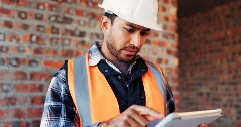 Confused, engineer or man at construction site with tablet, building problem or Foto stock