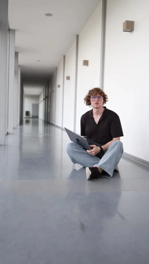 Confused freelancer works through a difficult project on a laptop Stock Footage 337851640