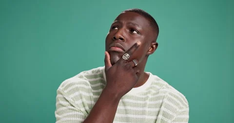 Confused, future and idea with black man on green background for problem solving Stock Footage 310984660