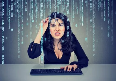 Confused girl coding on the computer 스톡 사진
