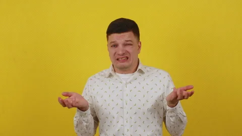 Confused guy 20 years old feels awkward and misunderstood Stock Footage 172045103